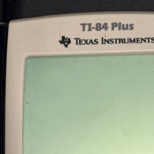 Texas Instruments TI-84 Plus Graphing Device in Black and Gray